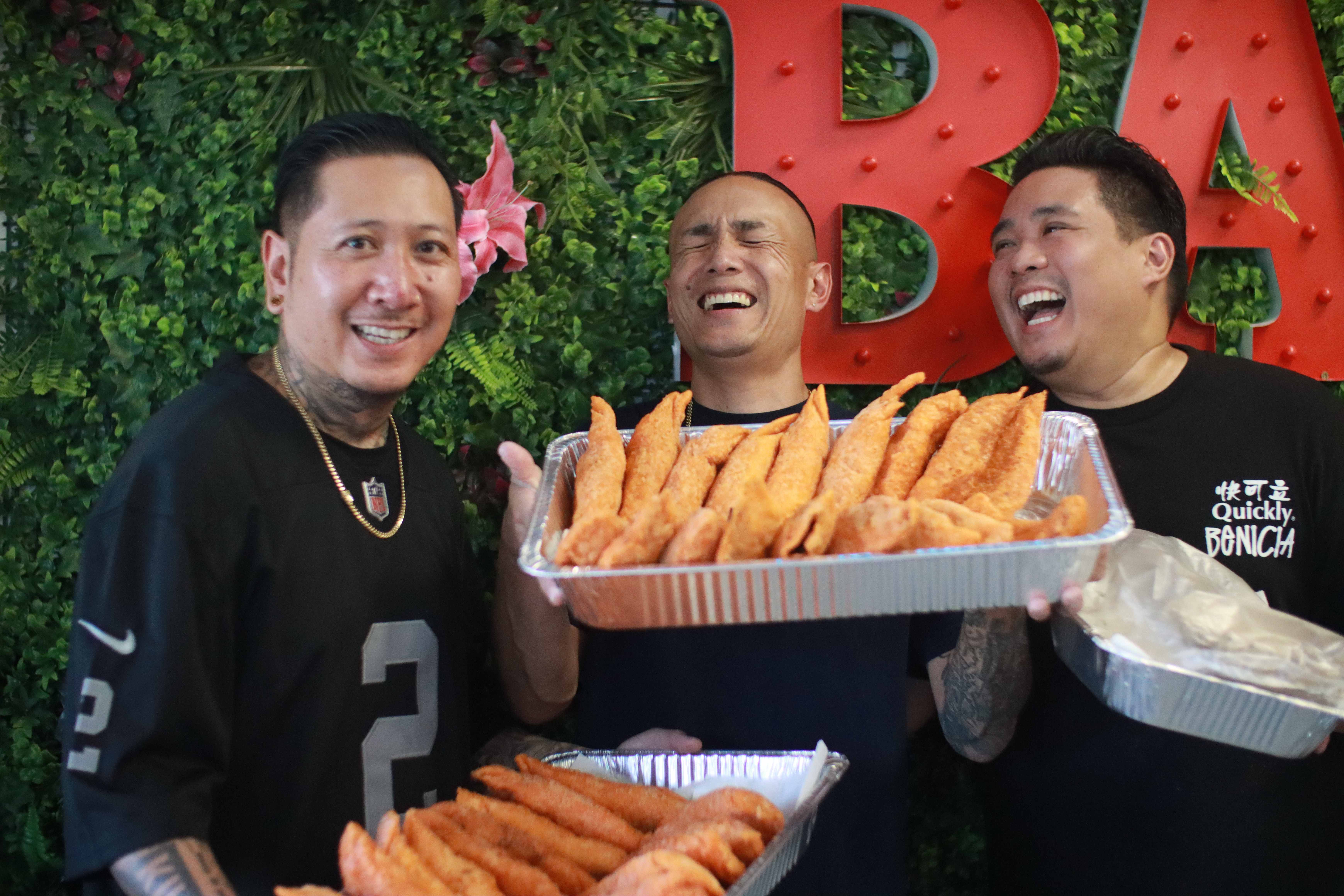 Quickly Benicia team holding trays of fresh empanadas