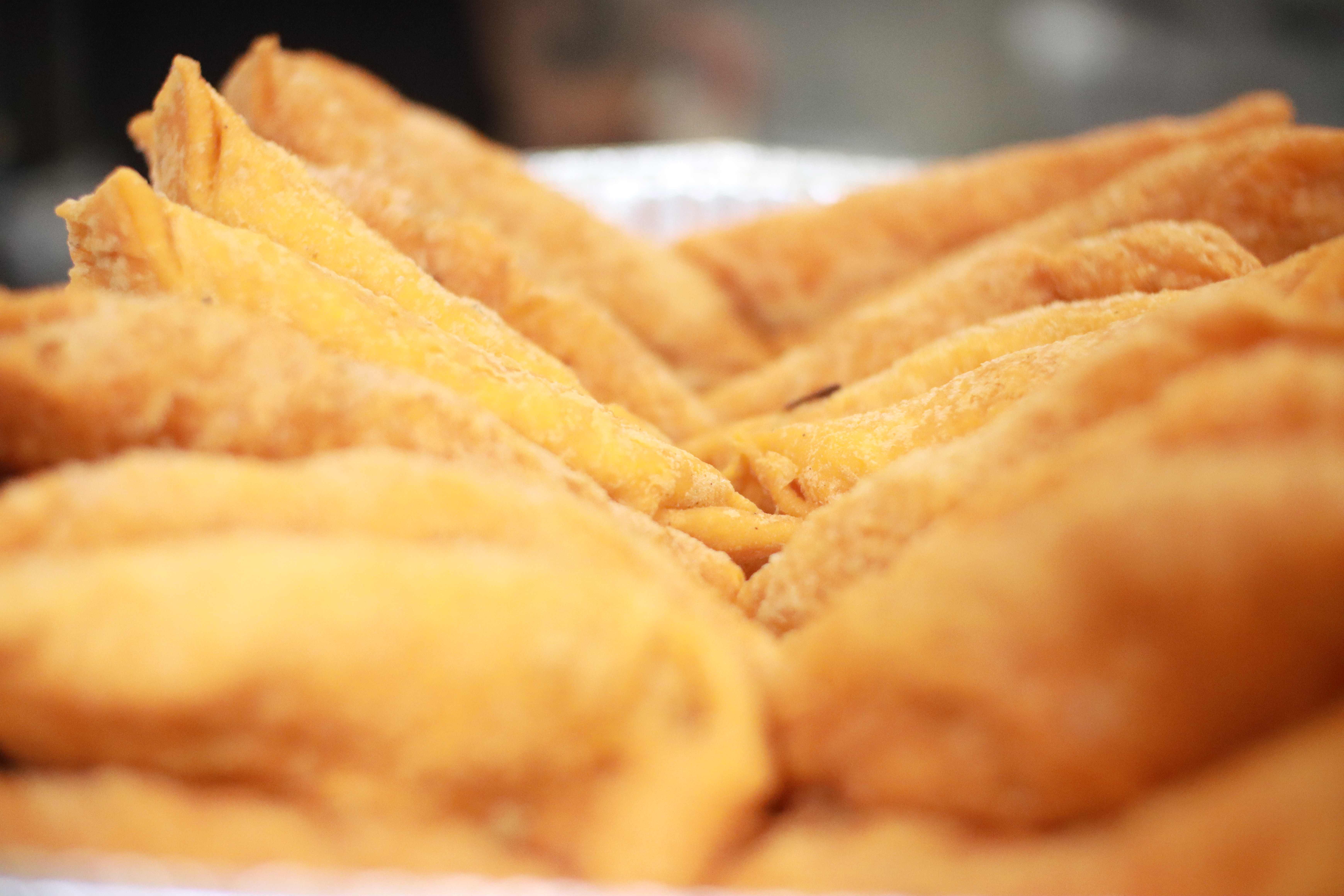 Artistic close-up of empanadas showing texture and layers